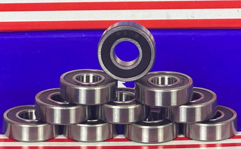 Understanding Bearings: The Basics of Functionality - a collection of metal ball bearings stacked on a colorful background.