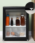 Black cabinet with transparent door showing beverages and snacks inside, featuring 12 Pieces Fixed Caster Wheels Set With One Inch Diameter Caster Wheels And Metal Top TPE Rubber Low Profile Rollers For Furniture Rolling Cabinets Trundle Beds And Drawers With Screws For Easy Installation at corners.