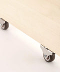 1 Inch Fixed Caster Wheels Set Of 4 With Silent Ball Bearings installed on wooden furniture for smooth rolling.