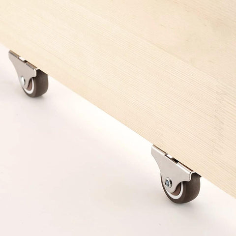 1 Inch Fixed Caster Wheels Set Of 4 With Silent Ball Bearings installed on wooden furniture for smooth rolling.