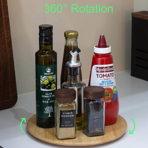10 inch bamboo wood lazy susan organizer designed for cabinets and countertops with spices and condiments on it.