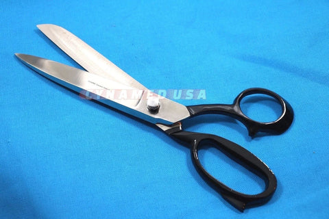 Heavy Duty 10 Inch Fabric Scissors Stainless Steel Tailor Shears For Leather And Fabric Cutting Professional Grade Ergonomic Handle Ideal For Sewing Dressmaking Crafting Home Office Tasks lying on blue fabric