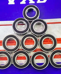 10-Pack 6800-2RS Bearings Sealed 10x19x5mm arranged in a pyramid on a colorful background, showcasing chrome steel and rubber seals.