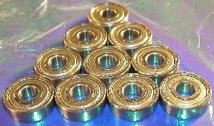 10-Pack Bearings 1603ZZ 5/16" x 7/8" x 9/32" - Miniature Bearings in triangular arrangement on metallic surface