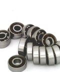 100 inline/Rollerblade/Skate Bearing Chrome Steel Open Ball bearing - Nylon Cage arranged in a group view.
