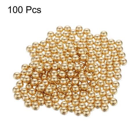 100pcs 6mm Solid Brass Bearing Balls piled for machinery, automotive, and DIY use