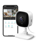 1080P Indoor Security Camera For Baby And Pet Monitoring With Motion Detection And Night Vision Two Way Audio Local SD Card Or Cloud Storage Works With Alexa And Google Home For Convenient Hands Free Home Surveillance next to phone display.