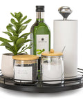 10 Inch Oak Wood Lazy Susan Turntable Organizer with spices, plant, and bottle, black finish, ideal for kitchen countertop display.