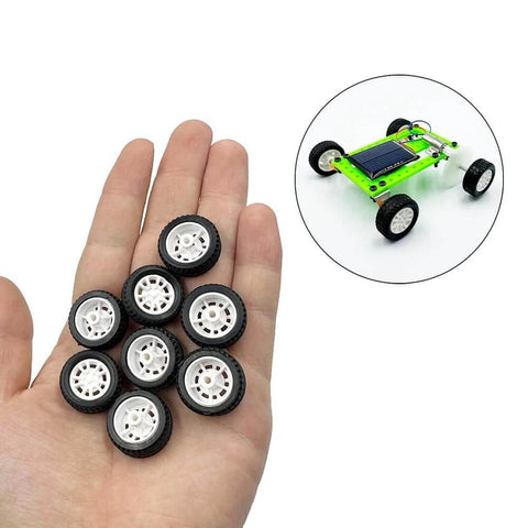 Hand holding 10pcs Toy Car Wheels 20mm Rubber Tires with 1.9mm Hole for 2mm Shaft DIY Model Accessories Small RC Car Truck Wheels 8mm Width