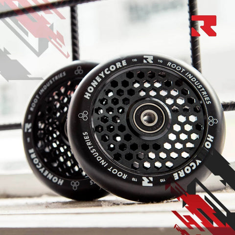 110mm Honeycore Pro Scooter Wheels Black on Black Lightweight Durable Design for Smooth Control displayed on a window sill
