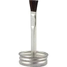 Front view of MMC78 nickel-base anti-seize lubricant brush applicator with metal screw-top jar.