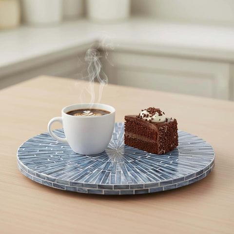 12.6 inch mother of pearl lazy susan turntable with blue starburst design featuring coffee cup and chocolate cake on countertop.