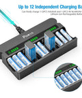 12 Bay Independent Fast Charging Battery Charger For AA AAA 9V NiMH NiCd LCD, loaded with batteries, showing LCD indicators.
