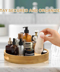 12 inch wooden lazy susan turntable organizer with handles, rotating acacia wood tray in use on a bathroom counter.