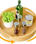12 inch bamboo lazy susan organizer with handles, non skid rotating spice rack designed for kitchen cabinets and countertops, featuring jars and plants.