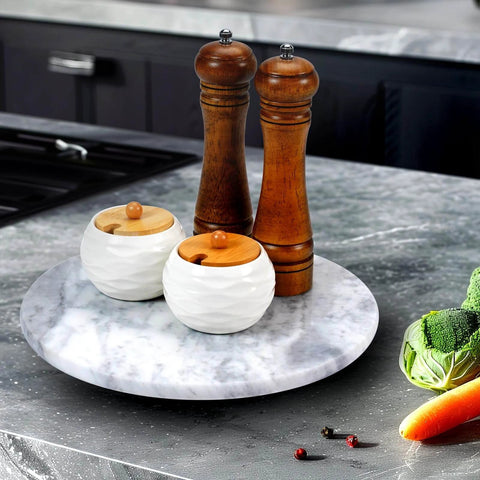 12 inch marble lazy susan turntable made from natural marble, showcasing wood pepper mills and salt cellars.