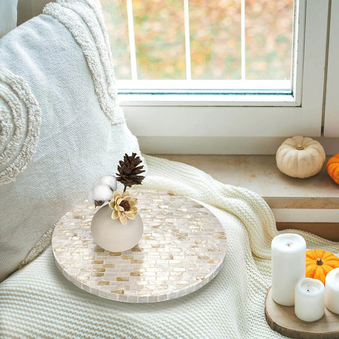 12 inch mother of pearl lazy susan turntable with marble pattern on a cozy windowsill with decorative accents.