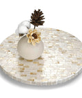 Close-up of 12 inch mother of pearl lazy susan turntable with marble pattern, decorative wooden rotating tray with decor.