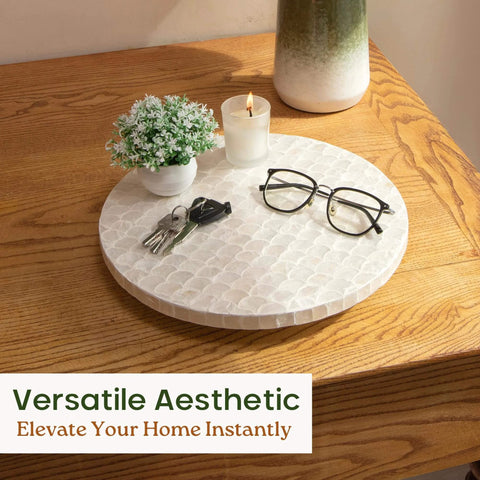 12 inch white capiz lazy susan turntable centerpiece with keys and glasses on a wooden table