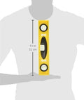 Image of a 12-Inch professional level with a shock-resistant, non-marring ABS body and top-read vial held by a person's arm.