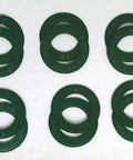 12-Pack Green Rubber Seals for 608 Skate Bearings arranged in circles on a flat surface for visibility.
