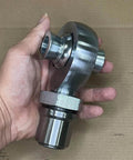 Hand holding 1.25 Heim Joint Rod End Kit with Right Hand Thread, showing 1 1/4 Chromoly Heat Treated Rod End, tube adapter, and jam nut