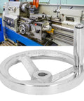 125mm Diameter Rotary Handwheel With 12mm ID Bore Cast Iron Chrome Plated Round Hand Wheel next to a lathe machine