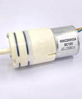 Close-up of 12V Brushless Starter Pump For Water Systems With Diaphragm Metering And Self Priming Control showing motor and wiring.