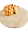 Natural Travertine Lazy Susan Turntable Organizer for Tabletop and Countertop 12 Inch Round Serving Tray with bread on top