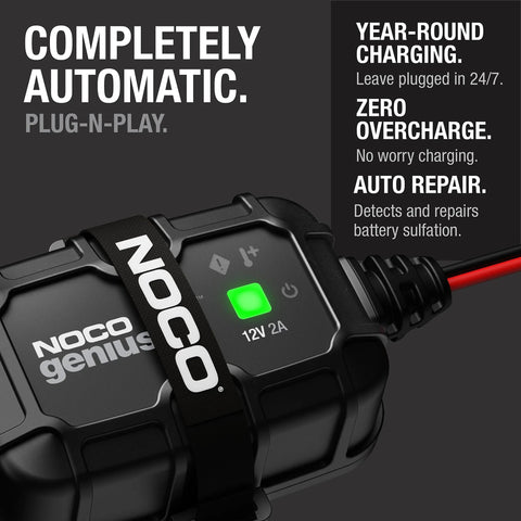 Close-up of NOCO Genius 2A 12V Smart Onboard Battery Charger Maintainer Desulfator With Overcharge Protection, black with green light.