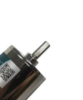 Close-up of 12V DC Geared Motor With 37mm Diameter Gearbox And Mounting Bracket, 600 RPM, showing shaft and QR code.
