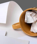 12x12 Inch Packing Paper 100 Sheets for Moving Fragile China and Glassware Protective Box Filler shown with a ceramic mug.