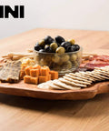 16 inch handmade root wood lazy susan turntable featuring assorted cheeses and charcuterie on a rustic wooden platter.