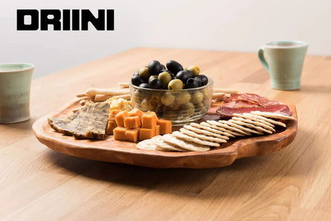 16 inch handmade root wood lazy susan turntable featuring assorted cheeses and charcuterie on a rustic wooden platter.