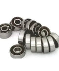 16 inline/Rollerblade/Skate Bearing Chrome Steel Open Ball bearing - Nylon Cage displayed in a scattered arrangement.