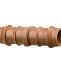 Close-up view of a barbed coupling, part of 25 Pack 1/2 Inch Drip Irrigation Barbed Couplings For 0.600 Inch ID Tubing, made of durable plastic.
