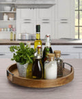 18 inch mango wood lazy susan serving tray holding bottles and herbs, round rotating centerpiece designed with a high wall for dining tables.