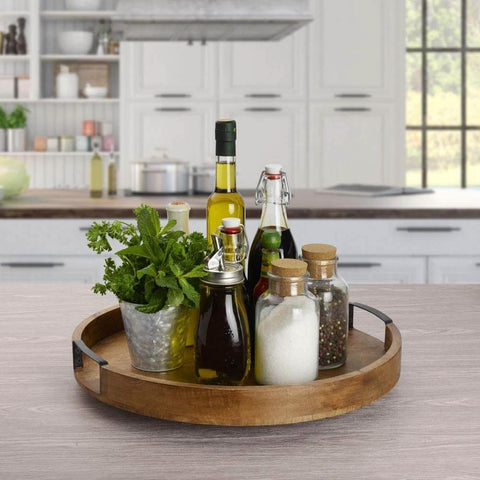 18 inch mango wood lazy susan serving tray holding bottles and herbs, round rotating centerpiece designed with a high wall for dining tables.