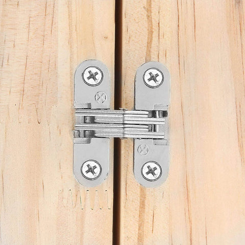 Installed Hidden Door Hinges Set For Cabinets 180 Degree Concealed Cross Hinges on wood surface