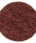 Red circular scouring pad with porous texture, suitable for cleaning and scrubbing surfaces.