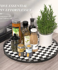 18 Inch Black And White Checkered Lazy Susan Turntable With Iron Frame Decorative Tray holding condiments and a plant