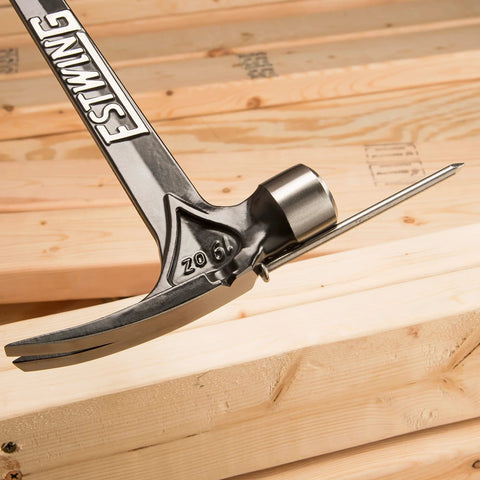 USA-made 19 oz rip claw framing hammer with milled face and shock reduction grip for carpentry, positioned on wooden beams