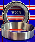 33117 Tapered Roller Wheel Bearing 85x140x41 chrome steel with cone and cup displayed in front of VXB packaging.