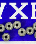 2x7x3 Shielded Ball Bearings Lot Of 10 For RC Cars And Trucks, chrome steel, arranged on blue VXB background