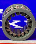 Front view of FE20Z One-Way Clutch 12x20x7mm - Slim Design - Sprag-Type showing metal sprags with a blue background.