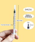Hand holding a 1ml syringe with cap, labeled dimensions, for 50 Pack 1ml Sterile Syringes With Caps Individually Wrapped For Safe Liquid Dosing Medicine Colostrum And Pet Liquids