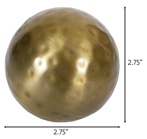 Close-up of a single 2.75 inch Decorative Ball in Antique Brass, part of a 6-piece set for bowls or vase fillers.