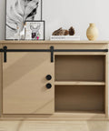 Closet with sliding door featuring 2-inch round black finger pulls, showcasing matte black finish against a light wood cabinet.