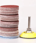 Stacked sanding discs and backing pad from 2 Inch Sanding Discs Set 80 To 3000 Grit With One Quarter Inch Shank Backing Pad