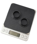 Two Pack Black Axle Protection Covers for Bike Bearings Dust Covers on digital scale